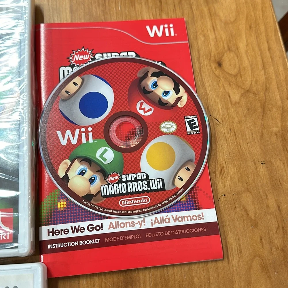 Nintendo Wii black w 2 remotes and 7 games.6 games in cases 1 has no case.